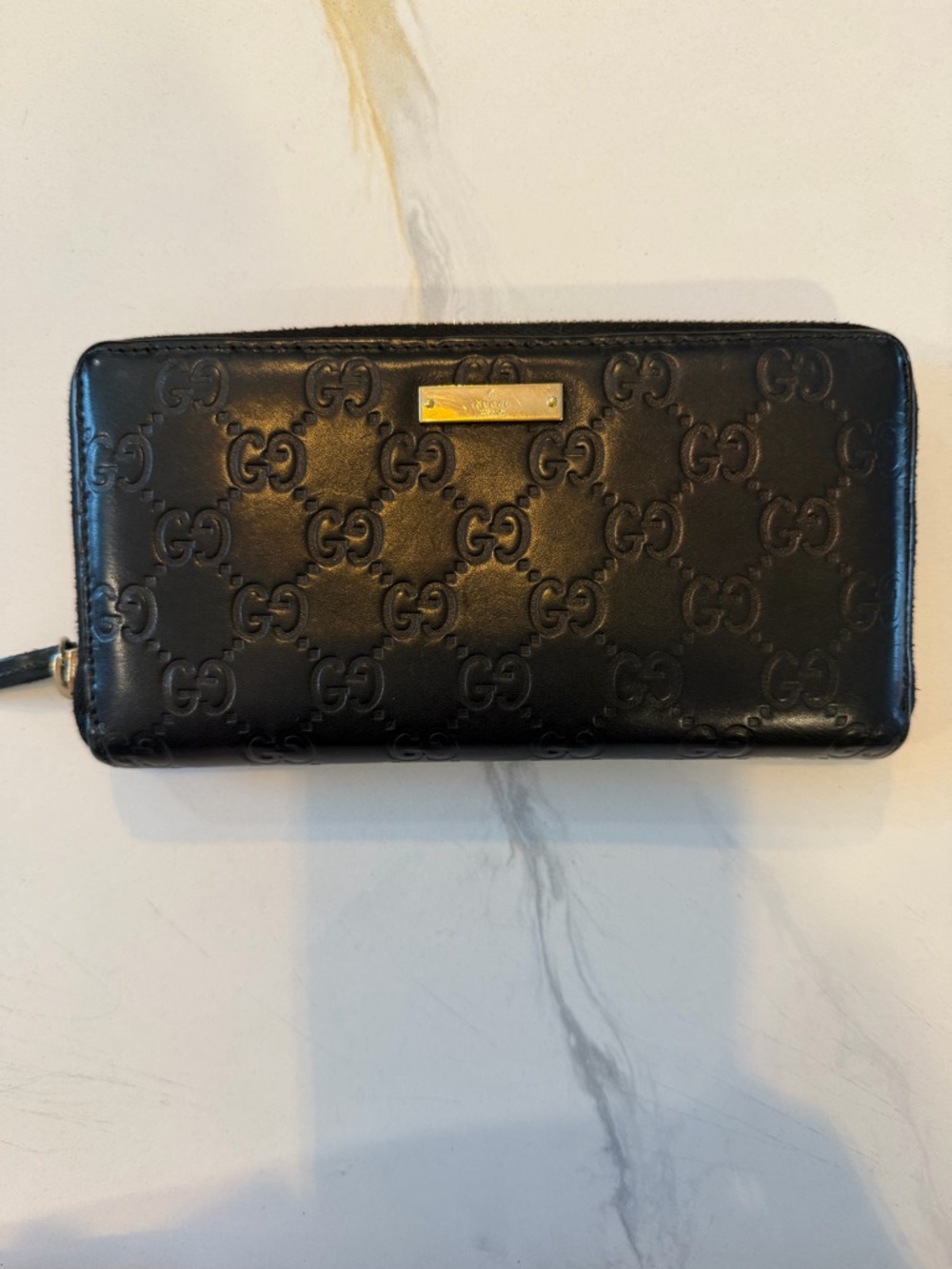 Gucci Black Embossed GG Leather Zip Wallet with Gold Plaque